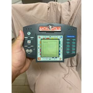 Monopoly 1997 Hasbro Electronic Handheld Game Parker Brothers Tested and Works